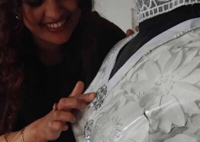 Siyma Hussein working on her collage dress. Work priced at £800